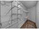 Walk-in closet featuring wire shelving and carpeted floor at 2075 Warwick Dr, Oldsmar, FL 34677