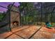 Screened-in outdoor living space with stone fireplace feature at 2075 Warwick Dr, Oldsmar, FL 34677