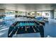 Spacious game room featuring a foosball table, ping pong table, and comfortable lounge seating at 2075 Warwick Dr, Oldsmar, FL 34677