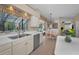 Charming kitchen offers a double sink, eating nook, and scenic backyard views at 2075 Warwick Dr, Oldsmar, FL 34677