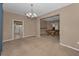 Open living and billiards space featuring neutral walls and carpet at 2075 Warwick Dr, Oldsmar, FL 34677