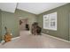 Versatile office space with a desk, chair, and natural light, connected to other living areas at 2075 Warwick Dr, Oldsmar, FL 34677