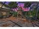 Outdoor patio with stone fireplace and dining set at 2075 Warwick Dr, Oldsmar, FL 34677