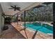 Outdoor pool with spa and a built-in fireplace at 2075 Warwick Dr, Oldsmar, FL 34677
