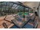 Screened-in pool area featuring outdoor dining area and private spa at 2075 Warwick Dr, Oldsmar, FL 34677