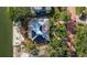 An aerial view of the property showcasing lush landscaping and waterfront access at 2158 Blossom S Way, St Petersburg, FL 33712