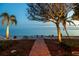 Beautiful backyard with a bench, a brick path and waterfront views at 2158 Blossom S Way, St Petersburg, FL 33712