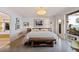 Calm bedroom with modern decor, sleek floors, and a glimpse into the luxurious bathroom at 2158 Blossom S Way, St Petersburg, FL 33712