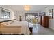 Bright bedroom boasts water views, contemporary furnishings, and minimalist decor at 2158 Blossom S Way, St Petersburg, FL 33712