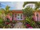 Charming home entrance with brick path, lush landscaping, and a bright double-door entryway at 2158 Blossom S Way, St Petersburg, FL 33712