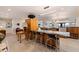 Contemporary kitchen showcasing a stainless steel island and wood cabinetry with modern appliances at 2158 Blossom S Way, St Petersburg, FL 33712