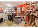 Well-organized laundry room with shelving, wine racks, and appliances at 2158 Blossom S Way, St Petersburg, FL 33712