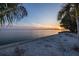 Scenic waterfront view at sunset, showcasing the tranquil water and distant bridge at 2158 Blossom S Way, St Petersburg, FL 33712