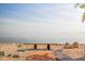 Bench overlooks the expansive waterfront and skyline in a serene and picturesque setting at 2158 Blossom S Way, St Petersburg, FL 33712