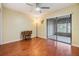 Comfortable bedroom featuring neutral walls, laminate floors, desk, ceiling fan, and closet at 2263 Citrus Ct, Clearwater, FL 33763