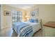 Bright bedroom featuring neutral walls, tile floors, ceiling fan, and closet at 2263 Citrus Ct, Clearwater, FL 33763