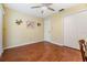 Bedroom featuring neutral walls, laminate floors, ceiling fan, and closet at 2263 Citrus Ct, Clearwater, FL 33763