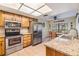 Well-lit kitchen features stainless steel appliances, granite countertops and eat in dining at 2263 Citrus Ct, Clearwater, FL 33763