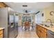 Eat-in kitchen features stainless steel refrigerator and table with seating at 2263 Citrus Ct, Clearwater, FL 33763