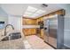 Bright kitchen featuring stainless steel appliances, granite countertops and tile flooring at 2263 Citrus Ct, Clearwater, FL 33763