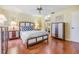 Comfortable main bedroom featuring two end tables, dresser, ceiling fan, and closet at 2263 Citrus Ct, Clearwater, FL 33763