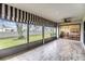 Screened in porch with a view of lawn, landscaping, and Primary bedroom at 2263 Citrus Ct, Clearwater, FL 33763