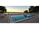 Community pool overlooking the lake at sunset at 2263 Citrus Ct, Clearwater, FL 33763
