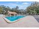 A beautiful pool with a gazebo and lounge chairs surrounded by trees at 2263 Citrus Ct, Clearwater, FL 33763