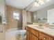 Bathroom featuring shower-tub combo, marble countertop and accent tile at 2300 S Shore Se Dr, St Petersburg, FL 33705