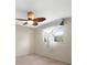 Bedroom with a decorative ceiling fan and window with sheer curtains for light at 2300 S Shore Se Dr, St Petersburg, FL 33705