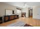 Spacious bedroom featuring hardwood floors, ceiling fan, and ensuite bathroom at 2300 S Shore Se Dr, St Petersburg, FL 33705