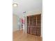 Bedroom featuring hardwood floors, closet, and view to adjoining living room at 2300 S Shore Se Dr, St Petersburg, FL 33705