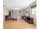 Bright bedroom with ceiling fan, hardwood floor, and water views at 2300 S Shore Se Dr, St Petersburg, FL 33705