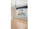 Bedroom with chandelier and large window offering an expansive waterfront view at 2300 S Shore Se Dr, St Petersburg, FL 33705
