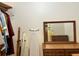 Hall closet with clothes and ironing board at 2300 S Shore Se Dr, St Petersburg, FL 33705
