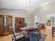 Elegant dining room featuring hardwood floors, a decorative chandelier, and classic wooden furniture at 2300 S Shore Se Dr, St Petersburg, FL 33705