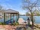 Beautiful dock with a boat lift provides access to waterfront living and stunning water views at 2300 S Shore Se Dr, St Petersburg, FL 33705