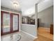 Inviting foyer featuring decorative glass doors leading into an open-concept home with elegant lighting at 2300 S Shore Se Dr, St Petersburg, FL 33705