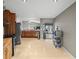Open kitchen with oak cabinets, stainless steel appliances and bright, airy access to an outside patio at 2300 S Shore Se Dr, St Petersburg, FL 33705