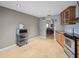 Kitchen with stainless steel appliances, tile flooring, and gray accent wall at 2300 S Shore Se Dr, St Petersburg, FL 33705