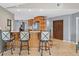 Kitchen with bar seating and stainless steel appliances at 2300 S Shore Se Dr, St Petersburg, FL 33705