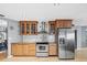 Kitchen featuring stainless steel appliances, wood cabinets, and an efficient layout at 2300 S Shore Se Dr, St Petersburg, FL 33705