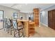 Kitchen with bar seating, wood cabinetry, and easy access to other living areas at 2300 S Shore Se Dr, St Petersburg, FL 33705