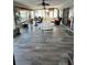 Expansive lanai with neutral tile, ceiling fans and plentiful windows for natural light and water views at 2300 S Shore Se Dr, St Petersburg, FL 33705