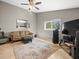 Cozy living room area with ceiling fan and large windows at 2300 S Shore Se Dr, St Petersburg, FL 33705