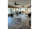 Sunroom interior showcasing seating, tables, water views, and bright natural light at 2300 S Shore Se Dr, St Petersburg, FL 33705