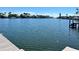 Beautiful waterfront view of dock and shoreline with clear waters at 2300 S Shore Se Dr, St Petersburg, FL 33705