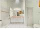 Spacious bathroom with a shower, toilet, double sink vanity, and natural light at 2348 Rolling View Dr, Spring Hill, FL 34606
