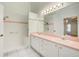 Modern bathroom with double sinks, a walk-in shower, and ample vanity space at 2348 Rolling View Dr, Spring Hill, FL 34606