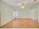 Open-plan bedroom boasts a ceiling fan and a window with natural light at 2348 Rolling View Dr, Spring Hill, FL 34606